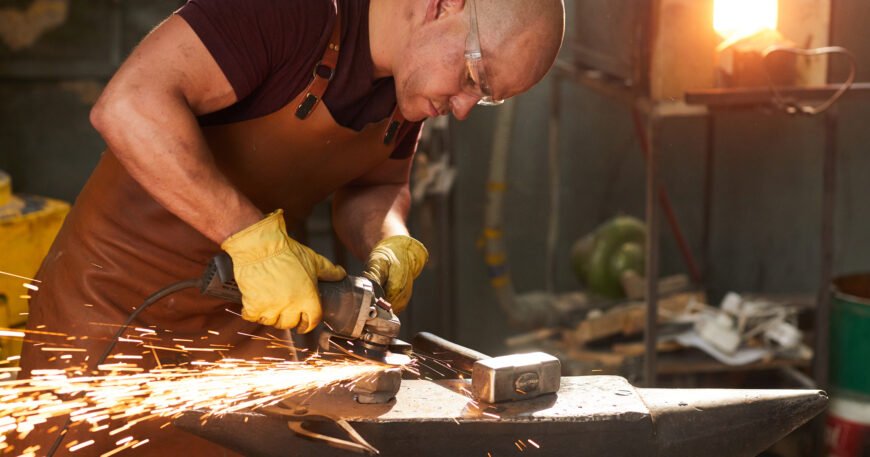 young workman polishing metal with grinder 2025 03 05 05 49 37 utc